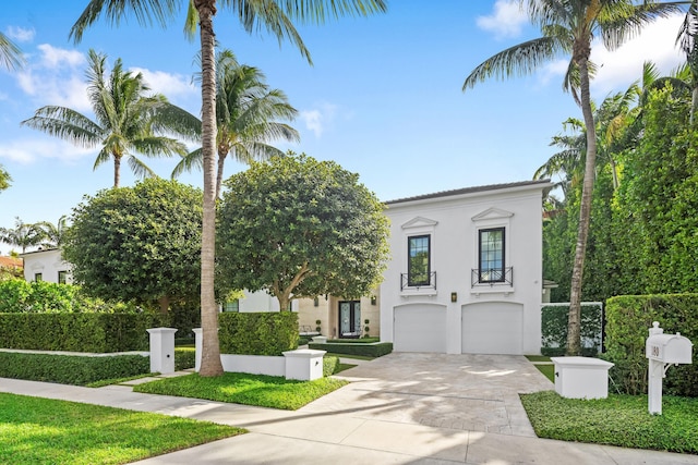 mediterranean / spanish-style house with a garage