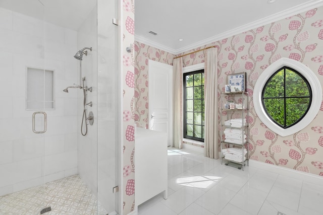 bathroom featuring a shower with door and ornamental molding