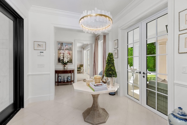 entryway with a notable chandelier, light tile patterned flooring, ornamental molding, and french doors