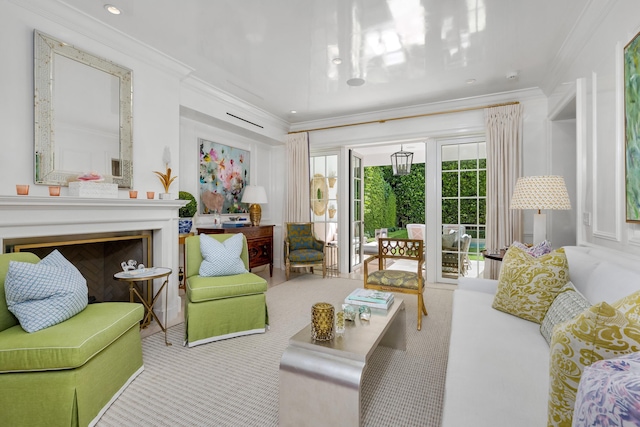 living area with crown molding and light colored carpet