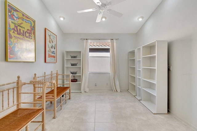 interior space featuring vaulted ceiling and light tile patterned flooring