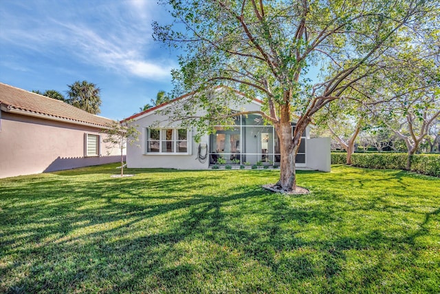 view of yard featuring a sunroom