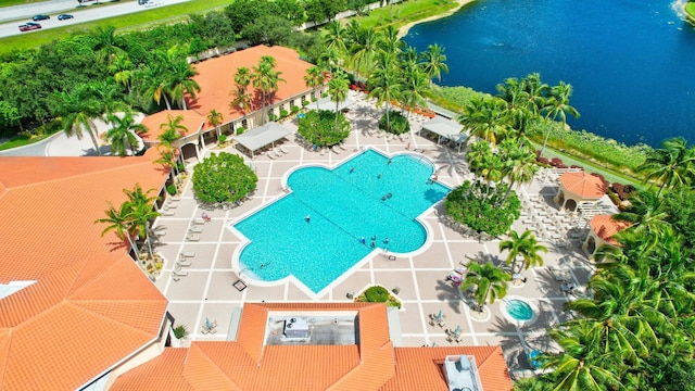 birds eye view of property with a water view