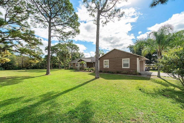 view of front facade with a garage and a front lawn