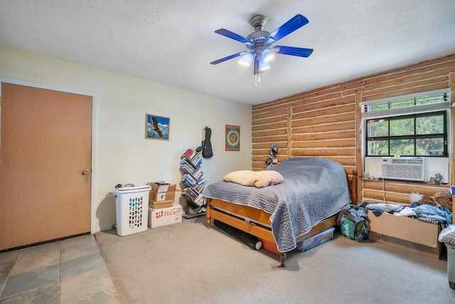 bedroom with a textured ceiling, ceiling fan, and cooling unit