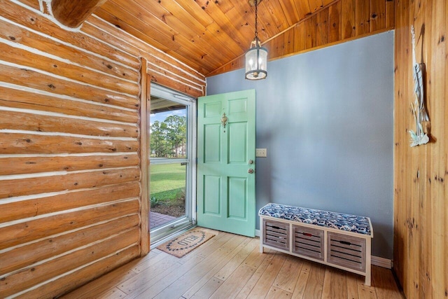 foyer with light hardwood / wood-style flooring, rustic walls, lofted ceiling, and wood ceiling