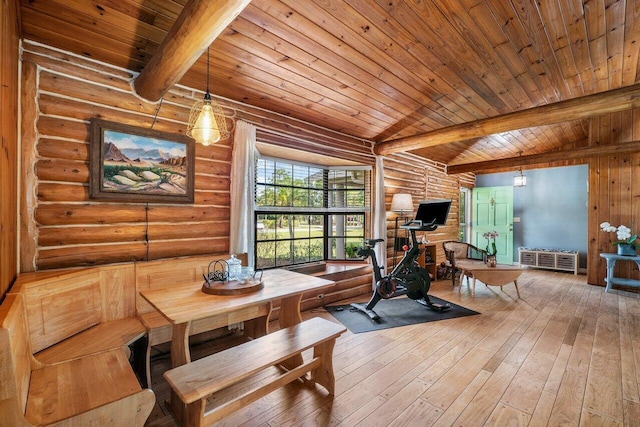 interior space with log walls, wood ceiling, and hardwood / wood-style flooring