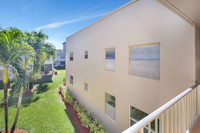 view of property exterior featuring a lawn