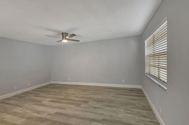 spare room featuring ceiling fan and light hardwood / wood-style floors