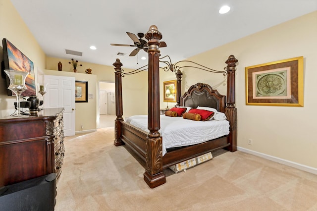 bedroom with ceiling fan and light colored carpet