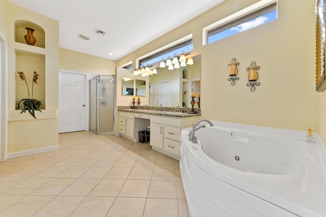 bathroom with tile patterned flooring, vanity, and separate shower and tub