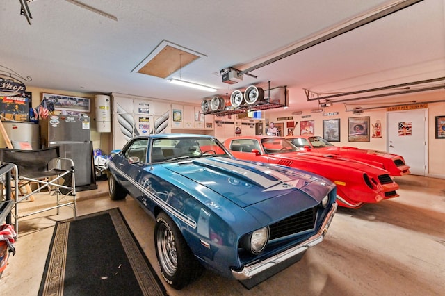 garage with a garage door opener and gas water heater