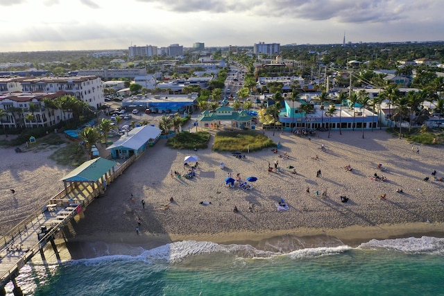 birds eye view of property featuring a water view and a view of the beach