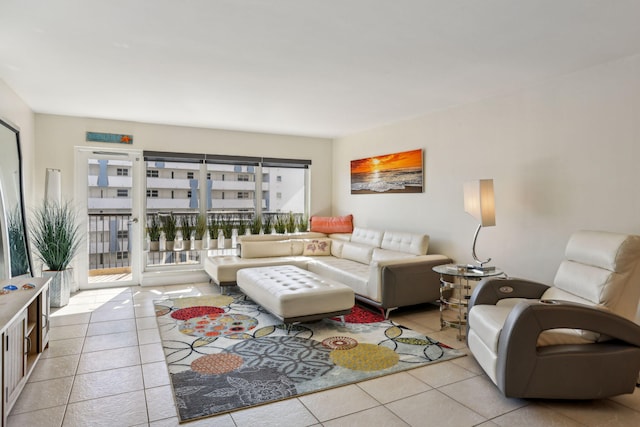 living room with a wealth of natural light and light tile patterned flooring