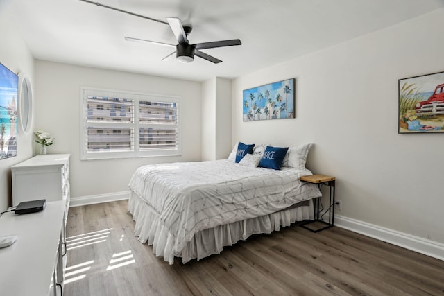 bedroom featuring ceiling fan and hardwood / wood-style floors