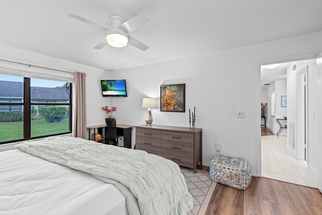 bedroom featuring light wood-type flooring and ceiling fan