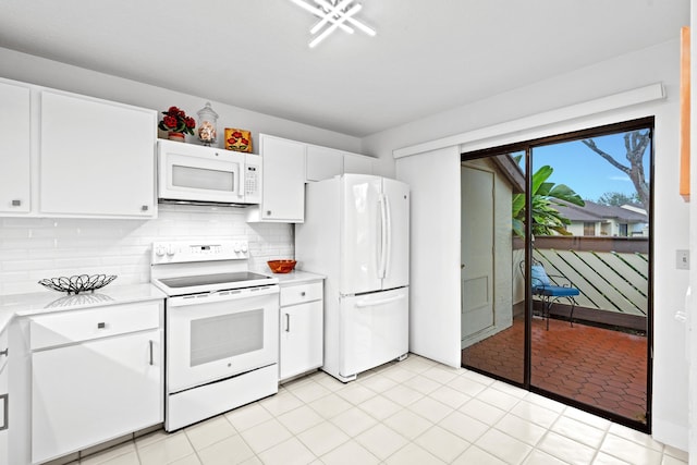 kitchen featuring white cabinets, decorative backsplash, light tile patterned floors, and white appliances