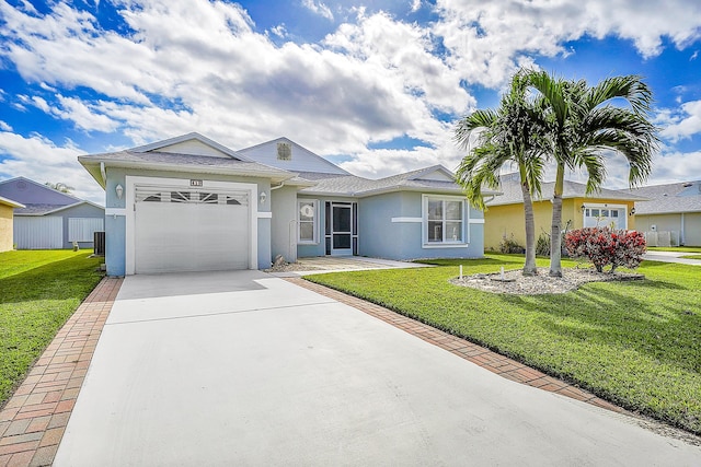 ranch-style home featuring central AC unit, a garage, and a front lawn