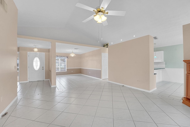 interior space with light tile patterned floors, ceiling fan, and lofted ceiling