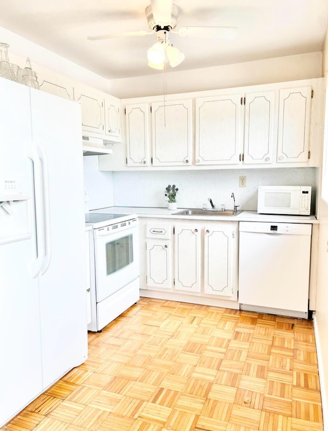 kitchen featuring ceiling fan, sink, white cabinets, and white appliances