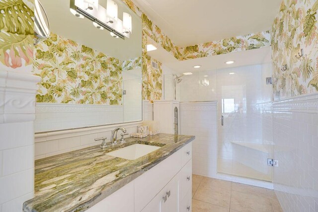 bathroom with vanity, tile patterned floors, and a shower with shower door