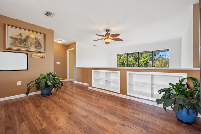 unfurnished room with ceiling fan and wood-type flooring