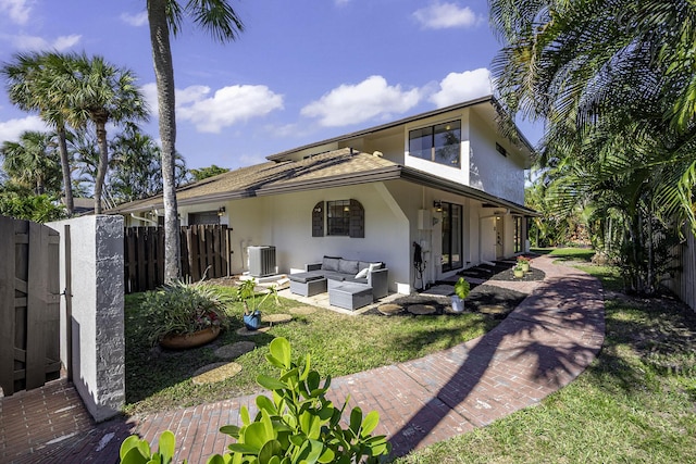 back of property featuring central air condition unit and an outdoor hangout area