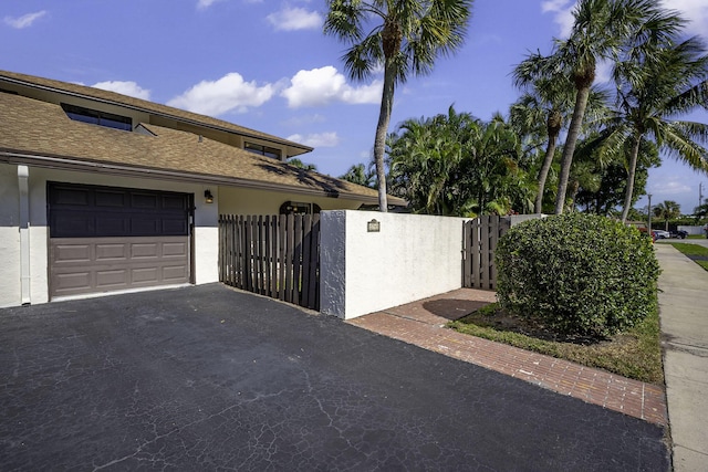 view of property exterior featuring a garage