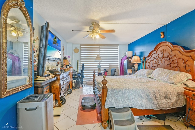 bedroom featuring light tile patterned floors, a textured ceiling, and ceiling fan