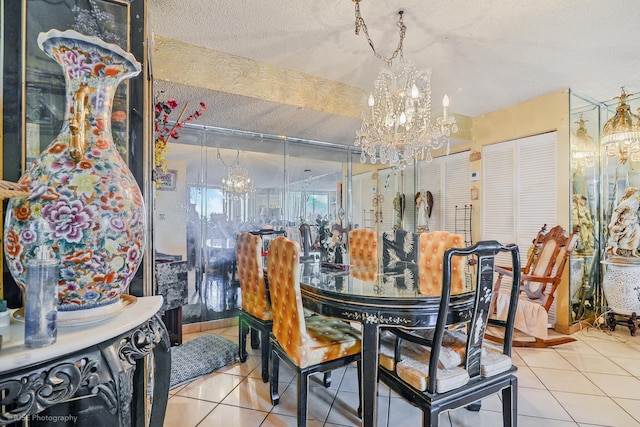 dining room featuring a textured ceiling and tile patterned floors