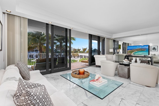 living room with floor to ceiling windows