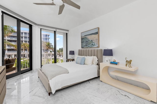 bedroom with multiple windows, access to outside, a wall of windows, and ceiling fan