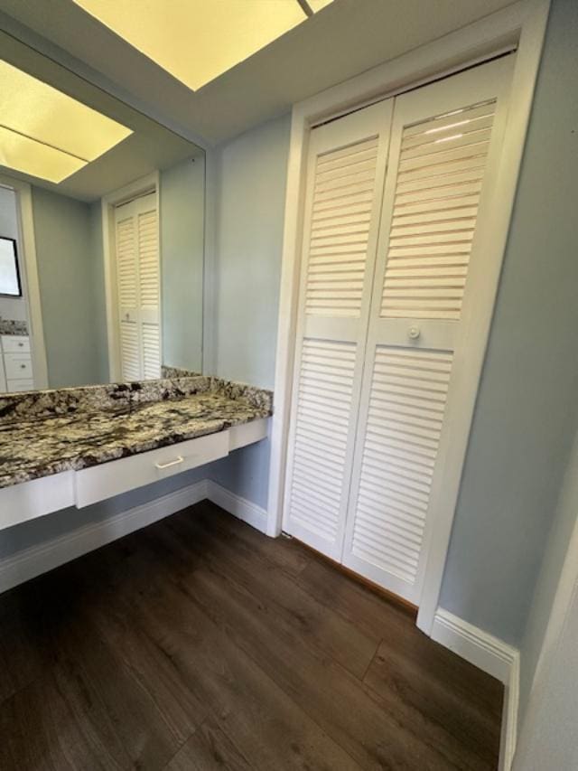 bathroom with hardwood / wood-style floors and vanity