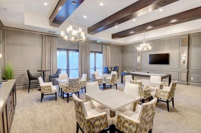 carpeted dining space featuring beamed ceiling and an inviting chandelier