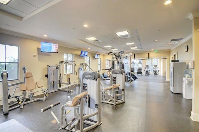 exercise room featuring ornamental molding