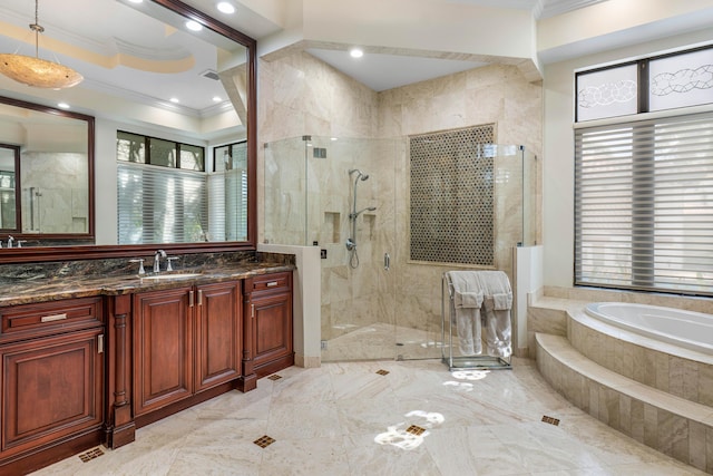 bathroom featuring ornamental molding, separate shower and tub, and vanity