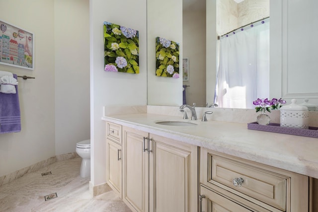 bathroom with vanity and toilet