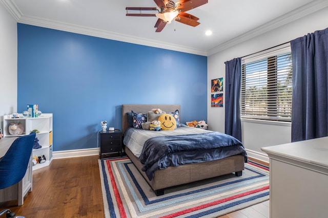 bedroom featuring crown molding, wood-type flooring, and ceiling fan