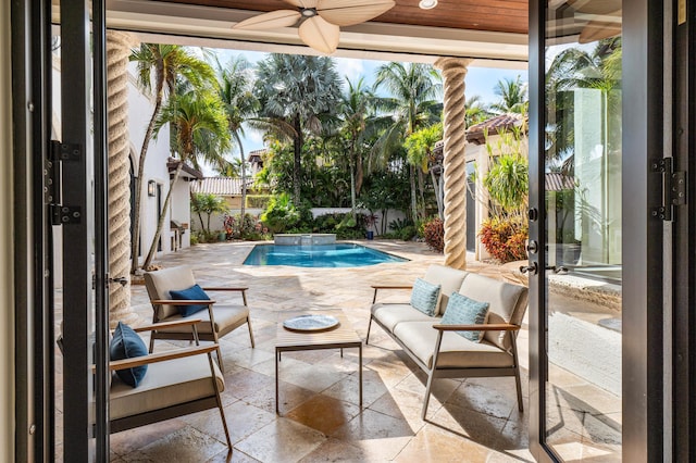 view of pool featuring ceiling fan and a patio area