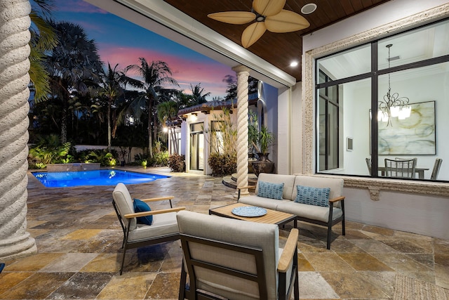 patio terrace at dusk with ceiling fan, outdoor lounge area, and a fenced in pool