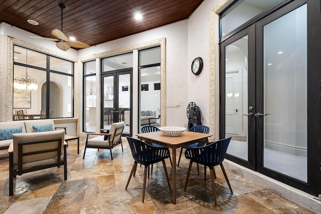 dining space with wooden ceiling and french doors