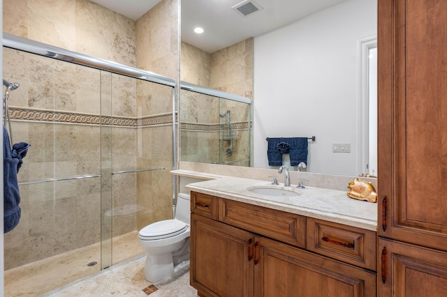 bathroom with vanity, an enclosed shower, tile patterned flooring, and toilet