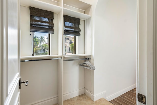 walk in closet featuring wood-type flooring