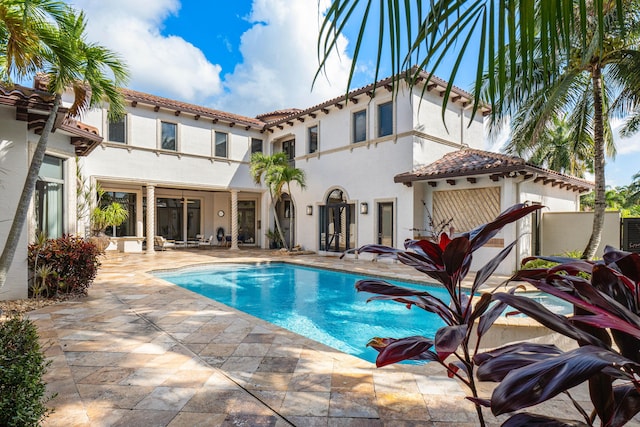 view of swimming pool featuring a patio area