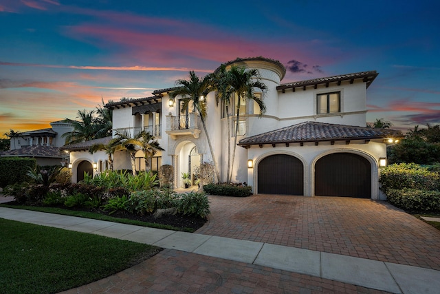 mediterranean / spanish-style house featuring a garage