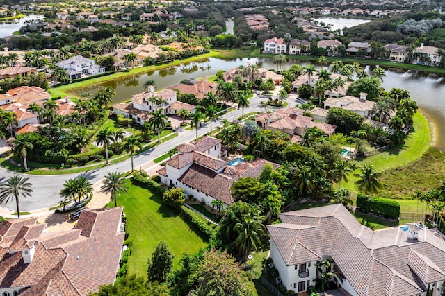 birds eye view of property with a water view