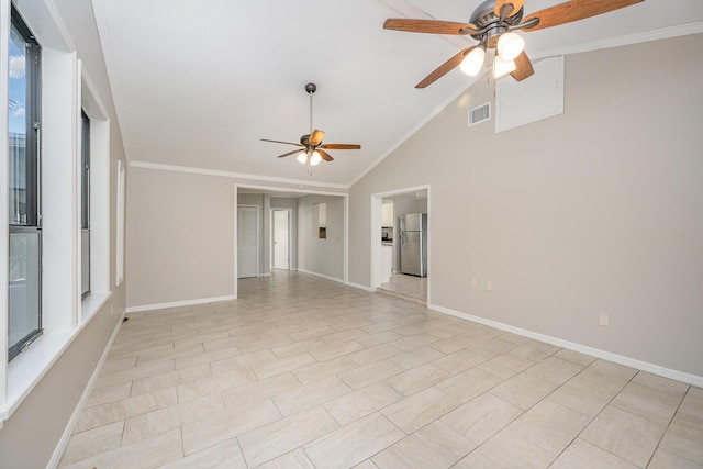 tiled spare room featuring ceiling fan, lofted ceiling, and ornamental molding