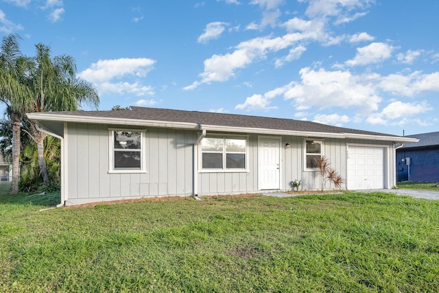 ranch-style home featuring a garage and a front yard