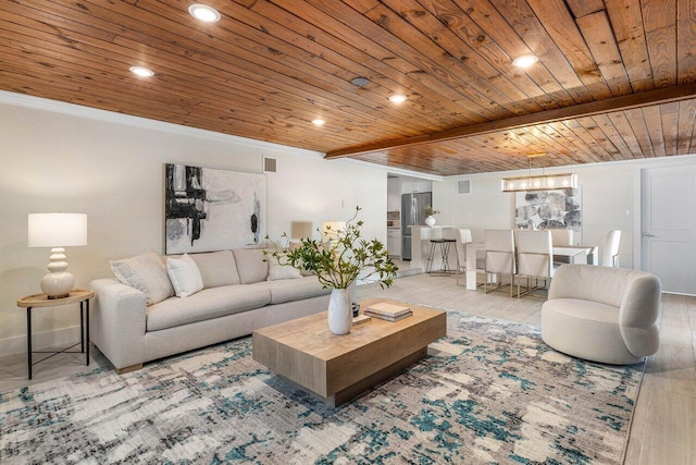 living room with beamed ceiling, light wood-type flooring, wood ceiling, and ornamental molding