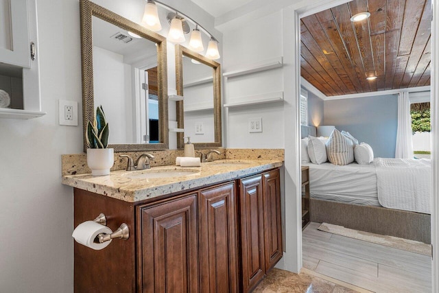 bathroom with hardwood / wood-style floors, vanity, wooden ceiling, and crown molding